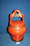 A Chinese red lacquer food box, late 19th c., with bisectional cover and carved handle a/f.