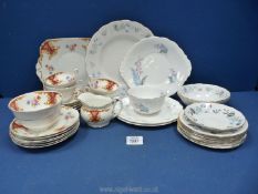 A pretty part teaset by Foley china in Rockingham design including four cups, saucers, milk jug,