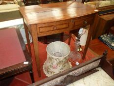 A circa 1900 bow fronted Oak Side Table having cross-banding to the top and to the drawer fronts