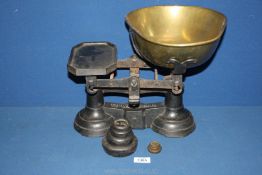 A set of Imperial Kitchen Scales and weights, approx. 15" wide x 12" tall.