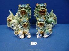 A pair of large green Dogs of fo, 9'' tall plus another similar pair, 5 1/2'' tall, a/f.