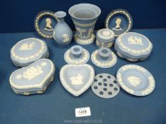 A quantity of pale blue Wedgwood Jasperware including trinket dishes, vases,