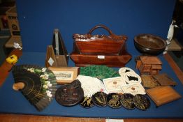 A box of miscellaneous wooden items including Metronome, wooden bowl, trough, etc.