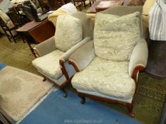 A pair of show Walnut framed fireside Armchairs upholstered in pale green with the seat and