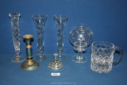 A heavy cut glass tankard, Dartington candle holder, etched bud vases and a brass candle holder.