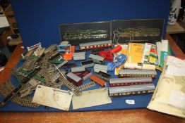 A quantity of model railway rolling stock including Hornby, carriages, track, etc.