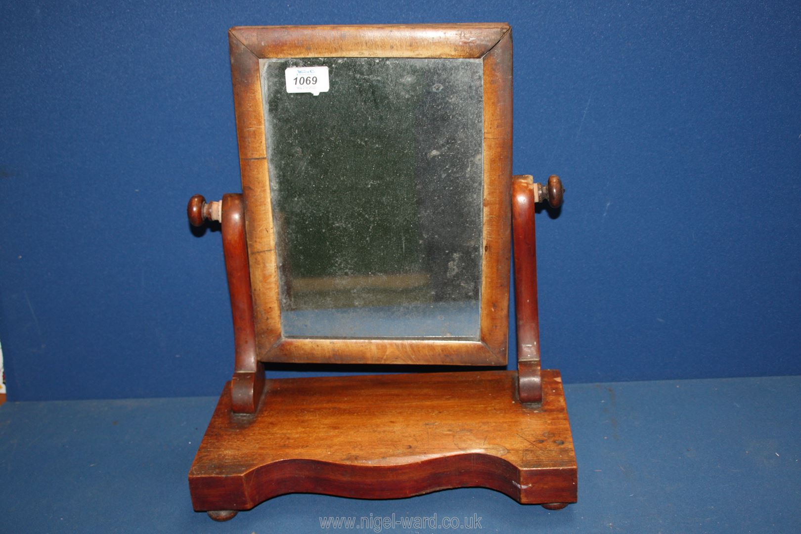 A darkwood Dressing table mirror a/f. 17" x 7".