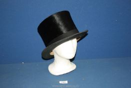 A black top hat by James of Eaton.