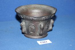 An antique French bronze mortar cast with classical bust medallions in the 17th c.