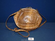 A Snakeskin Handbag.