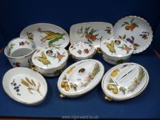 A quantity of Royal Worcester Evesham china including serving dishes, souffle dish, flan dish,