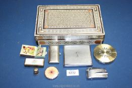 An inlaid box and contents including Atkinson's rouge compact, small manicure set, Stratton compact,