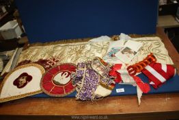 A small quantity of religious textiles, motives, banners,
