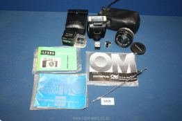 A cased Olympus Electronic Flash T20 OM system with the instruction book,