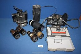 A Polaroid Land Camera Automatic 104, Canon AE-1 with 50mm lens, Polaroid Coldpack 82 camera,