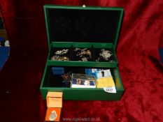 A green jewellery box containing; 375 gold St Christopher, a silver necklace,