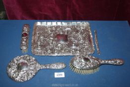 A pretty ladies Silver dressing table set including hand mirror, hairbrush and clothes brush,