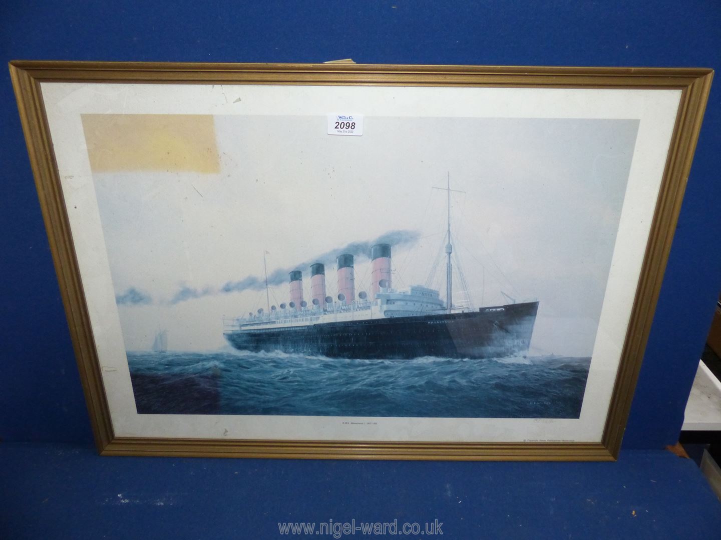 A signed print titled 'R.M.S Mauritania' 1907-1935 by E.D. Walker.