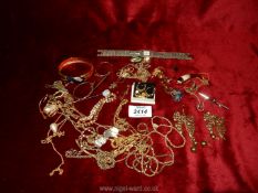 A quantity of jewellery to include necklaces, bangles, earrings and a Limit watch.