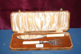 An Epns cake serving set with bone handles and silver bands, cased.