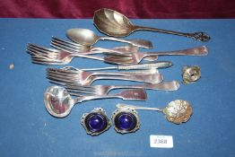 A small quantity of plated cutlery including forks and spoons and a small EPNS cruet with glass