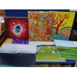 A quantity of unframed painted canvases including landscapes and abstracts.