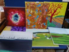 A quantity of unframed painted canvases including landscapes and abstracts.