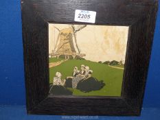 A small wooden framed Dutch print of ladies sat outside a windmill. 10" x 10".