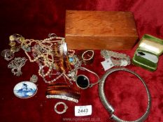 A wooden box of jewellery including a 1944 silver coin bracelet, Japanese bracelet, Delft brooch,,