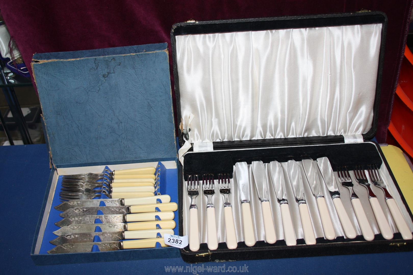 A boxed set of white handled Fish knives and forks plus another bone handled set.