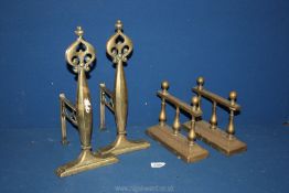 Two pairs of brass fire dogs,