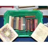 A green tub of books to include; The Sword in the Stone, Barnaby Rudge,
