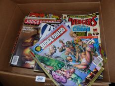 A quantity of Judge Dredd and The Avengers comics.