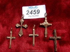 Five costume jewellery, yellow metal, crucifix pendants.