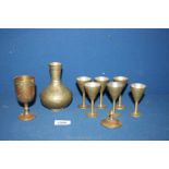 A small quantity old ornate Eastern style items including six goblets with matching vase and a