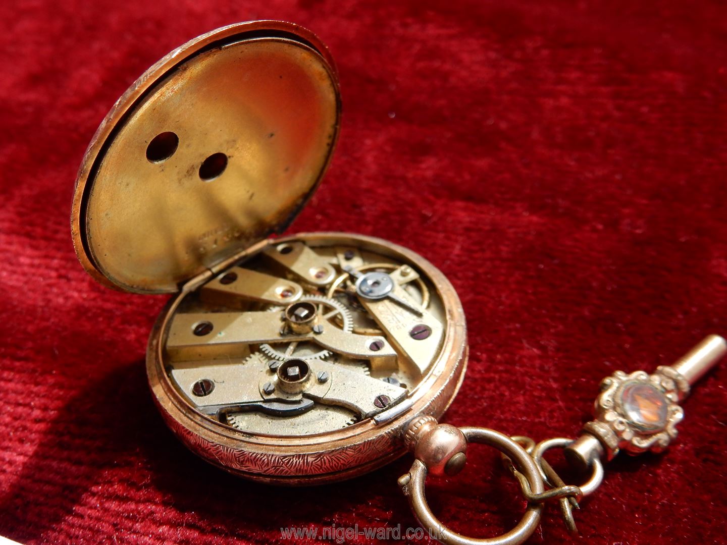 A 14 kt gold wind up Pocket Watch with floral and foliage engravings to the back and centre of the - Image 3 of 5