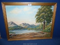 A framed Oil on board titled "Early Evening Coniston Water", signed lower left J.J.