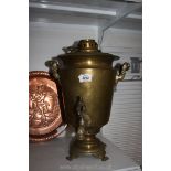 A brass Samovar with tap, 17 1/2'' tall x 13'' wide.