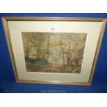 A framed and mounted Arthur Miles watercolour of figures in a woodland scene.