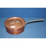 A copper saucepan with lid.