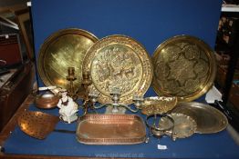 A quantity of mixed metals to include; brass chargers, candlesticks, copper skimmer,
