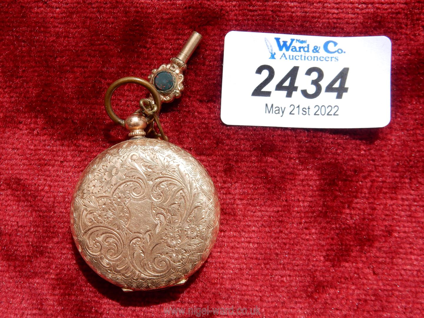 A 14 kt gold wind up Pocket Watch with floral and foliage engravings to the back and centre of the - Image 2 of 5