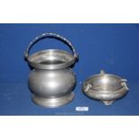 A pewter ashtray 6" wide x 2 1/2" deep and a pewter biscuit barrel 6" tall (no lid).