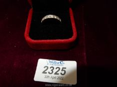 An 18ct. white gold half Eternity ring set with ten diamonds.