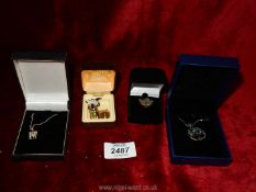 A quantity of costume jewellery animal pins, 'M' shaped pendant on chain, maple leaf pin, etc.