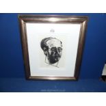 A framed and mounted charcoal portrait of a man. Image size 6 1/4" x 8 1/4".
