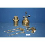 A miniature brass milk churn and contents of garden tools, brass measuring tape,