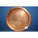 A copper tray with engraved 'Johnnie Walker' figure, 13 1/2" diameter.