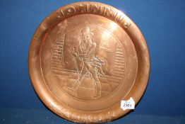 A copper tray with engraved 'Johnnie Walker' figure, 13 1/2" diameter.