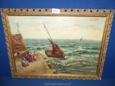 A framed Oil on canvas depicting a fishing boat coming into the harbour with ladies waiting to